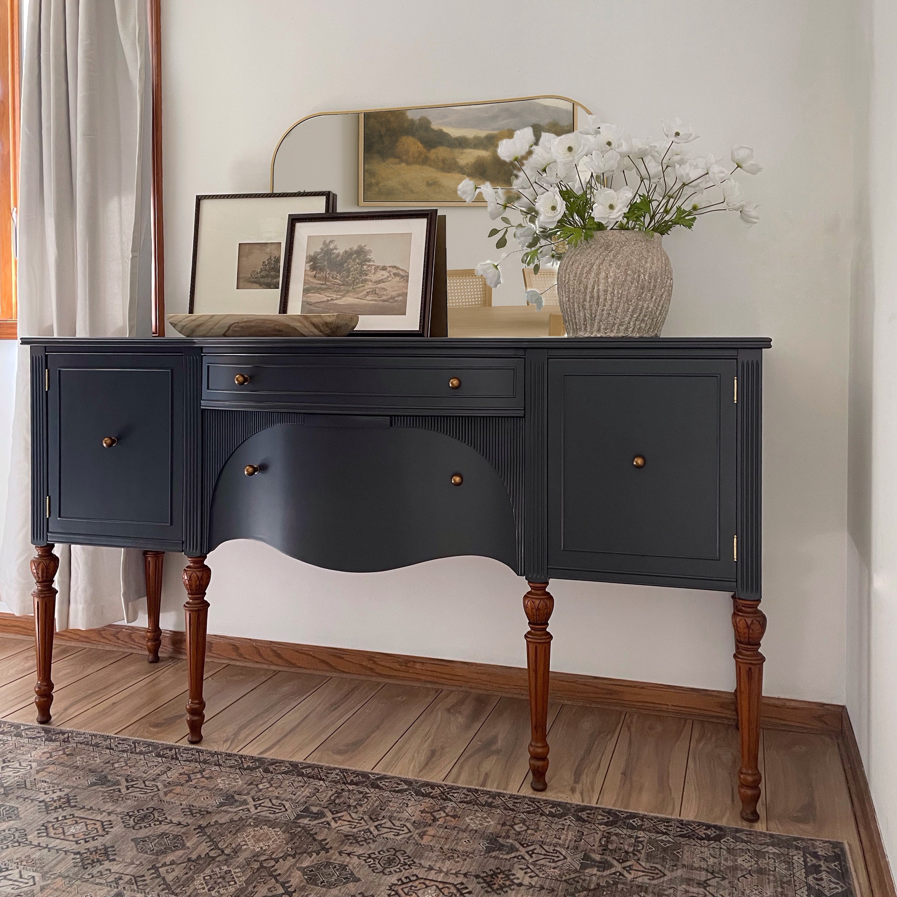 Antique Rockford National Furniture Co. sideboard professionally refinished in Sherwin Williams Inkwell with updated antique brass knobs and turned wood legs